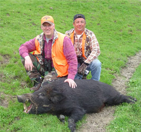 two hunters and a black hog