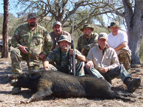 group of hunters with hog